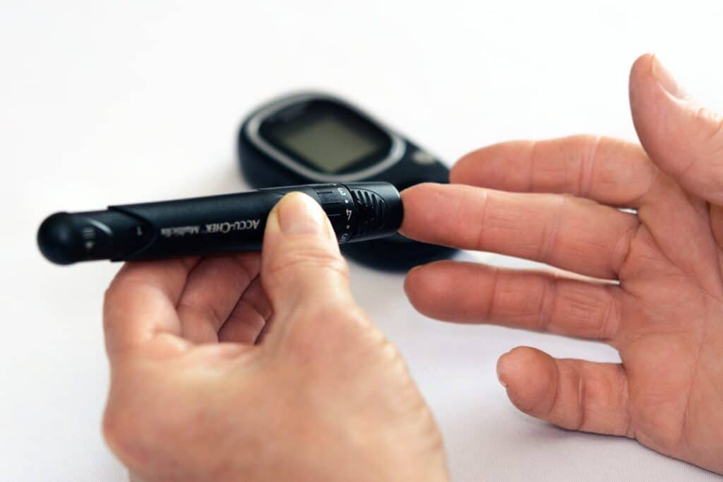 A person is checking their blood sugar level